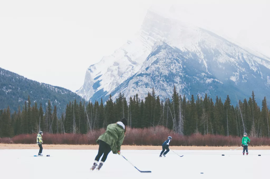 Many parents pass along their love for hockey to their children by playing together outdoors.